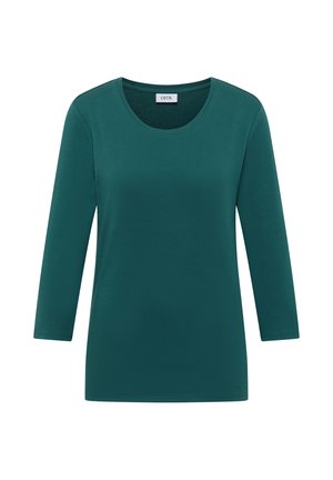 Chemise à manches longues bleu canard avec un col rond, design simple, et étiquette indiquant "CECIL" à l'intérieur du col.