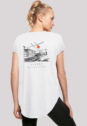 White t-shirt with short sleeves, featuring a black and red graphic design of a train scene on the back, rounded hem, and soft texture.