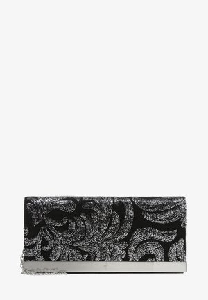 Sacoche noire avec un motif floral texturé en blanc, accent métallique argenté en bas, et une bandoulière amovible.