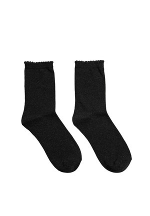 Paire de chaussettes noires mi-mollet avec des bords festonnés sur fond blanc, montrant les vues de face et de côté.