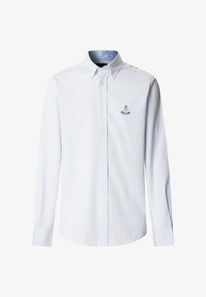 Camicia bianca a maniche lunghe con motivo a griglia blu, collo con bottoni e piccolo logo ricamato blu sul petto a sinistra.