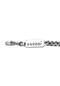 Silver metal bracelet with interlocking chain links. Features a rectangular tag engraved with "KUZZOI" and a lobster clasp for fastening.