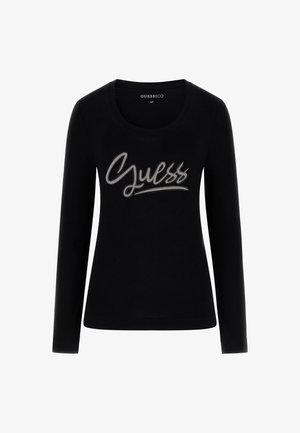 Czarna bawełniana koszulka z długim rękawem i okrągłym dekoltem. Na piersi znajduje się srebrne logo z akcentami z kryształków.
