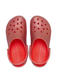 Red glitter clogs with a rounded shape, open toe, ventilation holes, and a flexible back strap. Smooth interior and textured outsole.