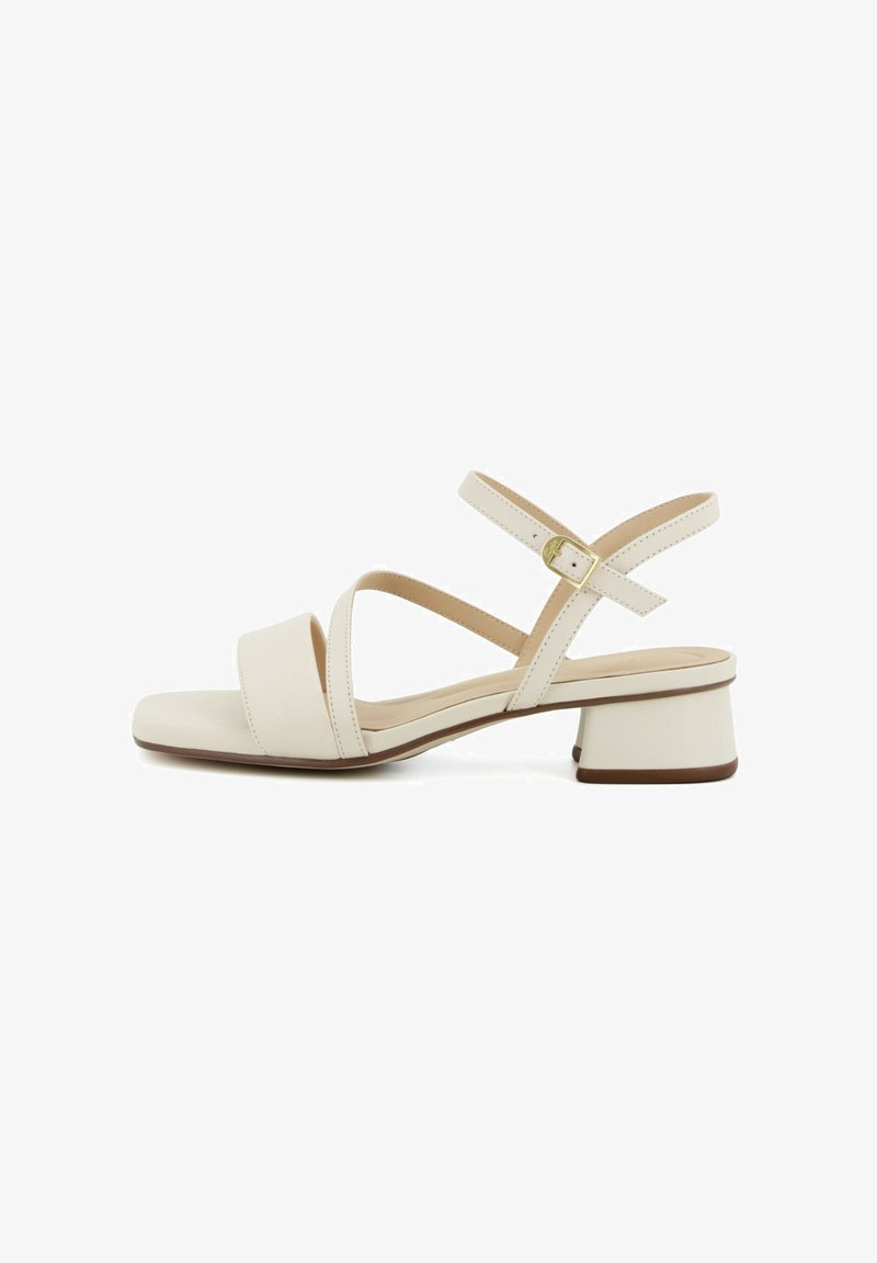 Beige leather open-toe sandal with two front straps, ankle strap with gold buckle, and low block heel.