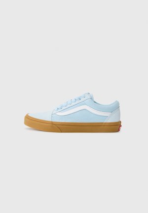 Light blue canvas sneaker with white side stripe, round toe, and brown rubber sole. Features tonal lace-up design and padded collar.