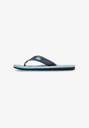 Infradito con una fascia in tessuto blu navy, dettagli blu, una soletta testurizzata e una suola sottile in gomma nera. Presenta un logo di marca sulla fascia.
