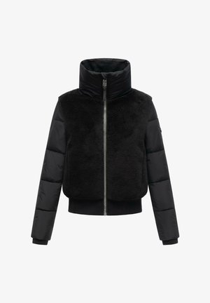Giacca nera con una parte superiore pelosa, maniche imbottite a trapunta, colletto alto e zip frontale con orlo a coste.