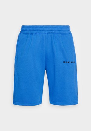 Short bleu à taille élastique avec poches latérales et l’inscription "MENNAGE" imprimée en noir sur la cuisse droite.