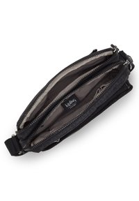 Black fabric pouch with two zippered compartments, featuring a textured exterior and a smooth interior lining. Kipling logo visible inside.