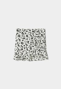 Blommig minikjol med svarta blommor på vit botten. Har en volangkant och sidofåll med dragsko-detalj.