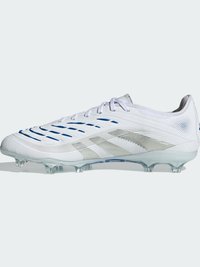 White soccer cleat with a textured upper, blue accents, and three silver stripes. Features a molded sole and clear, studded outsole.