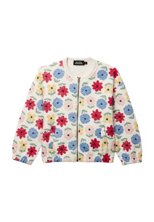Veste blanche matelassée avec fermeture éclair à l'avant, présentant un motif floral multicolore avec des fleurs rouges, bleues, jaunes et roses, accompagnées de feuilles vertes.