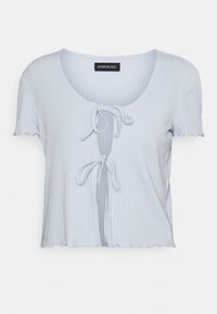 Světle modrý žebrovaný krátký rukáv cropped top se dvěma předními zavazováním a výstřihem do kulata.