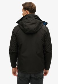 Superdry & Co ULTIMATE SD CHEATER - Chaqueta de entretiempo - black blue bay