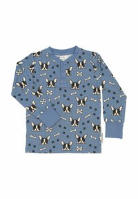 Pitkähihainen sininen puuvillapaita, jossa on mustavalkoinen kuvio, jossa on koiran kasvoja, luita ja tassunjälkiä; kolme nappia henley-kauluksessa.