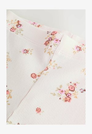 Virágmintás anyag, bordás textúrával, lágy rózsaszín árnyalatokban, kis rózsákkal és zöld kiegészítőkkel az egész felületen.