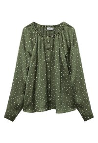 Blusa verde realizzata in tessuto morbido, con scollatura rotonda, maniche lunghe e motivo a pois bianchi; chiusura frontale con bottoni e arricciature.