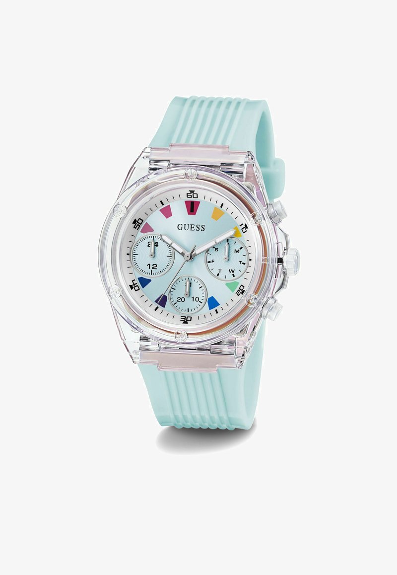 Orologio Guess trasparente con cinturino in silicone blu chiaro. Presenta un quadrante blu pastello, tre sottodial e indicatori delle ore colorati.