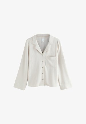 Camicia da pigiama beige chiaro con sottili righe verticali, colletto a revers, maniche lunghe, chiusura con bottoni e una tasca sul petto. Tessuto morbido al tatto.