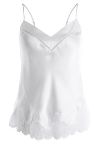 White satin camisole with thin straps, V-neckline, and lace trim along the hem. Smooth texture and fitted design.