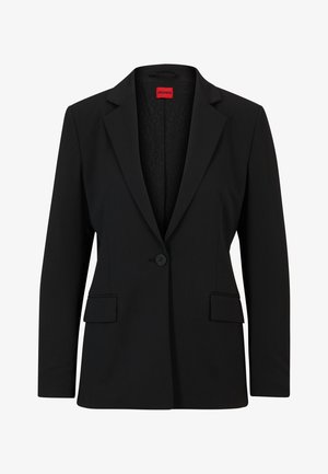 Blazer nero con rever a punta e chiusura a un bottone. Presenta due tasche frontali e una fodera liscia con un motivo sottile.