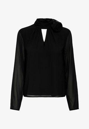 Blouse noire à manches longues avec manches en tissu transparent, encolure en trou de serrure, col haut et détail de rose en tissu sur le côté gauche du col.
