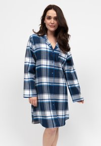 Camicia da notte a scacchi nei colori blu navy, grigio e bianco. Chiusura frontale con bottoni, maniche lunghe e colletto. Tessuto morbido con motivo a quadri.