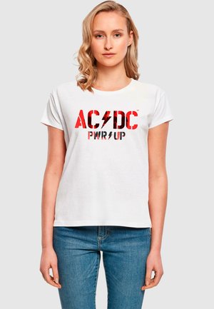 T-shirt bianca in cotone con logo AC/DC rosso e nero e testo "PWR UP". Maniche corte e vestibilità comoda. Design pulito e casual.