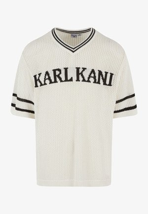 White knitted short-sleeve V-neck sweater features "KARL KANI" in black across the chest, with black stripes on the sleeves.
