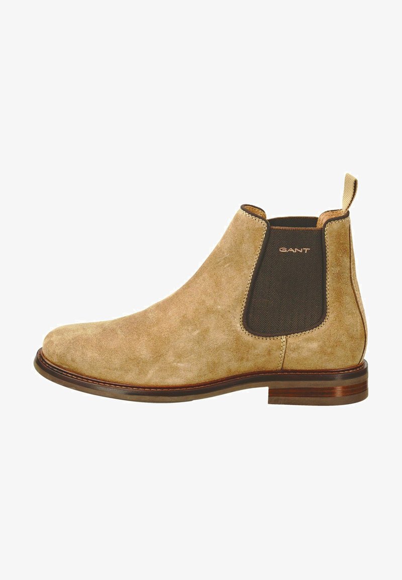 Beige Wildleder Chelsea-Stiefel mit elastischen Seiteneinsätzen und einer Zugschlaufe, mit runder Zehenform und Holzabsatz für Unterstützung und Stabilität.