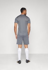 Nike Performance STRIKE SHORT - Sports shorts - iron grey/black/sunset pulse