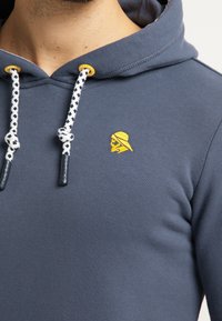 Schmuddelwedda Jersey con capucha - blue