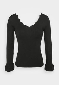 Haut en maille côtelée noire à manches longues, col en V festonné et poignets évasés. Texture douce, coupe ajustée.