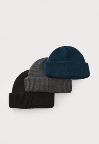 Three ribbed knit beanies stacked: one black, one dark gray, and one teal. Each has a turned-up brim and textured finish.