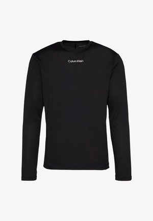 Maglietta nera a maniche lunghe con scollo tondo, con il logo "Calvin Klein" al centro del petto, mostrata su sfondo bianco.