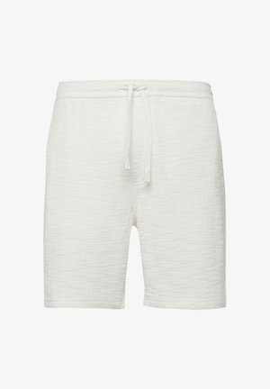 Short en tissu blanc texturé avec taille élastique et lien à nouer à l'avant, longueur genou.