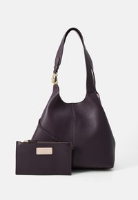 Purple leather hobo bag with a textured finish and a single shoulder strap. Includes a matching wallet with a zip closure and logo accent.