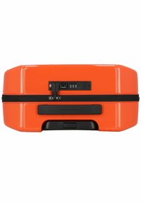 Orange hard-shell suitcase with a textured surface, dual zipper, black accents, and built-in USB port for charging devices.