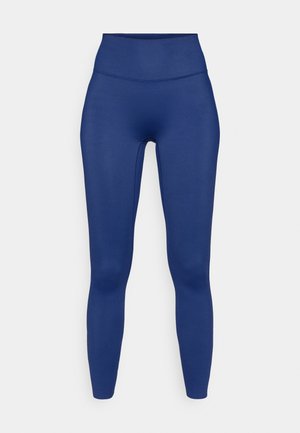 Navy blue leggings with a high waist, made from smooth, stretchy fabric. Features a seamless design for comfort and a fitted silhouette.