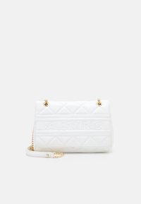 White quilted handbag with embossed "VALENTINO" logo, gold hardware, chain strap, and a rectangular shape. Smooth leather texture.
