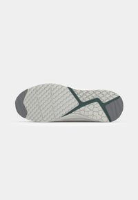 Shoe outsole featuring a textured, rubber surface with a hexagonal pattern. Color scheme includes light gray with dark gray and teal accents.