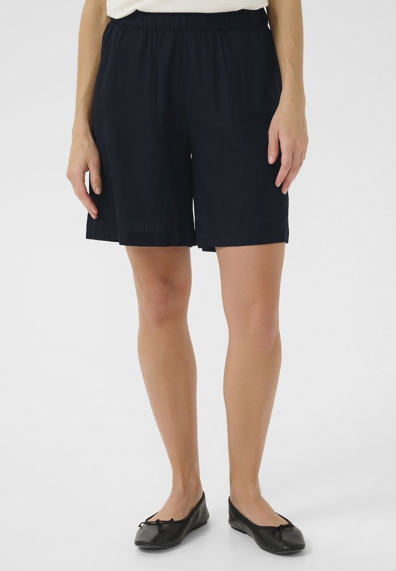 Navy blue tailored shorts with an elastic waistband, made of lightweight fabric, featuring a straight cut and no embellishments.