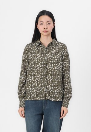 Camicia a maniche lunghe verde con motivo, dotata di colletto e decorata con motivi floreali bianchi. Vestibilità ampia con polsini a bottone e orlo che arriva ai fianchi.