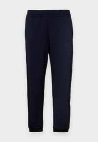 TROUSER - Tracksuit bottoms - blue