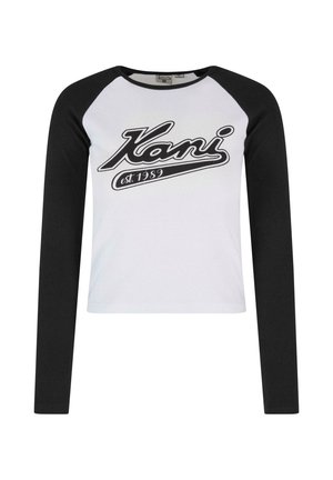 Garā piedurkne T-krekls ar baltu korpusu un melniem raglaniem piedurknēm, ar izteiktu melnu logotipu "Kani est. 1989" uz priekša.