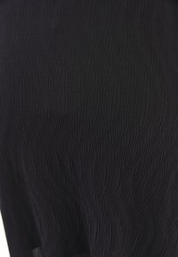 MIT ASYMMETRISCHEM SCHNITT - A-snit nederdel - black