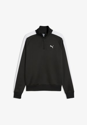 Maglione Puma bianco e nero con zip a quarto, collo e polsini a coste e logo Puma sul petto sinistro.
