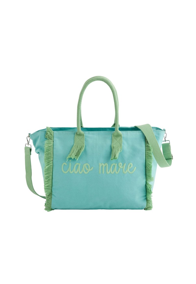 Canvas draagtas in mintgroen met lichtgroene franjes. Voorzien van geborduurde tekst "ciao mare" en een afneembare schouderriem.