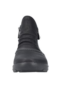Black leather ankle boot with a rounded toe, pleated design, side zipper, and rubber sole for traction. Soft texture and minimal stitching details.
